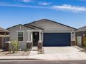 Charming one-story home showcasing a two-car garage, well-maintained landscape, and neutral tones at 37084 W Prado St, Maricopa, AZ 85138