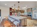 Spacious kitchen with large island, granite countertops, stainless appliances, and ample cabinet space at 37300 N Tom Darlington Dr # D, Carefree, AZ 85377