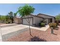 Lovely home with a well-kept lawn and charming curb appeal, featuring a spacious driveway at 4232 N 112Th Ln, Phoenix, AZ 85037