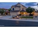 Charming two-story home with a well-manicured lawn and inviting curb appeal at 4715 E Carmen St, Phoenix, AZ 85044