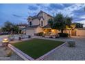 Charming two-story home with a well-manicured lawn, complemented by mature trees at 4715 E Carmen St, Phoenix, AZ 85044
