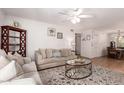 Bright living room flows into dining area, showcasing comfortable seating and stylish decor for easy living at 4950 N Miller Rd # 200, Scottsdale, AZ 85251