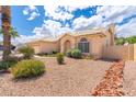 Attractive single-story home with desert landscaping, a tile roof, and an inviting entrance at 530 N Jesse Ct, Chandler, AZ 85225