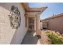 Close-up of the inviting front entrance, complete with stylish decor and an immaculate walkway at 6397 S Pinaleno Pl, Chandler, AZ 85249