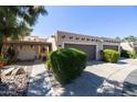 Charming exterior of the home with mature landscaping, a two car garage and a private entry at 6526 N 13Th Dr, Phoenix, AZ 85013