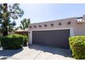 Street view of home showing garage, desert landscaping, and tile roof details at 6526 N 13Th Dr, Phoenix, AZ 85013