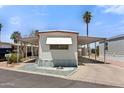 Well-maintained mobile home with a covered parking area and neat, low-maintenance yard at 701 S Dobson Rd # 259, Mesa, AZ 85202