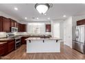Well-lit kitchen with stainless steel appliances and granite countertops at 7159 S Dodane Ct, Gilbert, AZ 85298