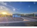 Cozy single-story home with desert landscaping and long driveway at 7318 E Arbor Ave, Mesa, AZ 85208