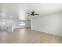 Open-concept floor plan featuring neutral walls, modern ceiling fans, and luxury vinyl plank flooring at 843 N Evergreen St, Chandler, AZ 85225