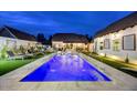 Backyard pool with fountains and lounge chairs, perfect for relaxation and outdoor entertaining at 87 W Windsor Ave, Phoenix, AZ 85003