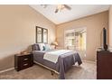 Cozy bedroom offers a comfortable bed, neutral walls, and natural light at 900 S 94Th St # 1166, Chandler, AZ 85224