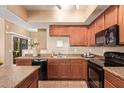 Functional kitchen offers ample countertop space and cabinets for easy meal preparation at 900 S 94Th St # 1166, Chandler, AZ 85224