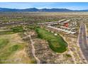 Aerial view of golf course community with a red marker on the home location at 9566 E Raindance Trl, Scottsdale, AZ 85262