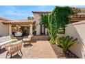 Inviting front patio area with comfortable seating and tiled flooring, perfect for outdoor relaxation at 9849 E Topaz Dr, Scottsdale, AZ 85258