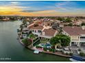 Beautiful waterfront home featuring a private pool, patio, and access to a picturesque lake community at 1700 E Lakeside Dr # 12, Gilbert, AZ 85234