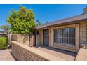Charming brick home featuring a cozy front patio and vibrant citrus tree at 2515 S Maple Ave # 104, Tempe, AZ 85282