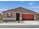 Inviting single-story home featuring a well-maintained front yard and a two-car garage at 37341 W San Clemente St, Maricopa, AZ 85138
