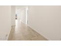 Bright hallway with tile flooring leads to an open-concept living space at 4347 W Hannah St, San Tan Valley, AZ 85144