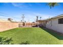 Expansive backyard featuring a lush green lawn, perfect for outdoor activities and relaxation at 6714 N 26Th Dr, Phoenix, AZ 85017
