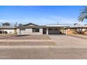Charming single-story home featuring a covered carport and low-maintenance landscaping at 6714 N 26Th Dr, Phoenix, AZ 85017