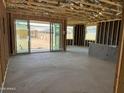 Spacious living room framing with large sliding glass doors offering great backyard views at 7603 W Avenida Del Rey --, Peoria, AZ 85383