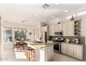 Bright open kitchen featuring stainless steel appliances and a granite island with a breakfast bar at 15140 E Staghorn Dr, Fountain Hills, AZ 85268
