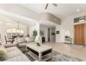 Bright living room with neutral colors, a ceiling fan and an open floorplan at 15140 E Staghorn Dr, Fountain Hills, AZ 85268