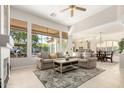 Bright living room featuring an open floorplan and large windows with a view of the backyard at 15140 E Staghorn Dr, Fountain Hills, AZ 85268