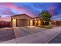 Charming single-story home featuring a two-car garage and manicured front yard at 196 W Yellow Wood Ave, San Tan Valley, AZ 85140