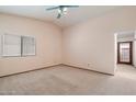 Bright bedroom showcasing a vaulted ceiling, carpet, and window, offering a peaceful retreat at 4029 W Grandview Rd, Phoenix, AZ 85053