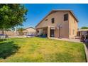Spacious backyard featuring a lawn, seating area, pool, and covered patio at 9646 N 94Th Ave, Peoria, AZ 85345