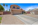 Inviting two-story home with a spacious driveway, two car garage and a well maintained lawn for an attractive curb appeal at 12745 W Monte Vista Rd, Avondale, AZ 85392