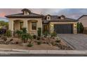 Charming single-Gathering home with a well-manicured front yard and neutral-colored stucco exterior, and a three car garage at 5931 E Sierra Morena St, Mesa, AZ 85215