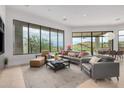 Bright living room featuring a comfortable seating area, floor to ceiling windows, and breathtaking outdoor views at 15332 E Hidden Springs Trl, Fountain Hills, AZ 85268