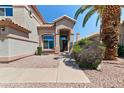 Charming home entrance with desert landscaping, a manicured bush, and a welcoming walkway at 162 W El Freda Rd, Tempe, AZ 85284
