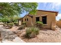 Charming home exterior featuring low maintenance desert landscaping and sidewalk at 1843 S Sunnyvale Ave, Gilbert, AZ 85295