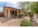 Charming single-story home with desert landscaping and covered entryway at 1843 S Sunnyvale Ave, Gilbert, AZ 85295