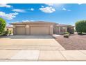 Well-maintained home featuring a spacious three-car garage and desert landscaping for low maintenance at 19005 N Diamante Dr, Surprise, AZ 85387