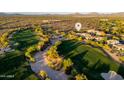 Scenic aerial view of a golf course community showcasing lush greens and well-maintained homes, ideal for a luxurious lifestyle at 23014 N 52Nd St, Phoenix, AZ 85054