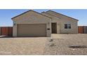 Charming single-story home featuring a two-car garage, block wall, and desert landscaping at 26308 W Camino Del Sol --, Casa Grande, AZ 85193