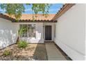Close-up showcasing the entryway with the front door and a well-kept landscape at 2640 E Mallory St, Mesa, AZ 85213