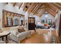 Spacious main bedroom with exposed beams, sitting area, and abundant natural light, offering a relaxing retreat at 27050 N 103Rd St, Scottsdale, AZ 85262