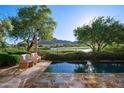 Stunning pool with scenic views of the golf course and desert mountains, perfect for relaxing in a tranquil setting at 27050 N 103Rd St, Scottsdale, AZ 85262