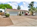 Attractive single-story house showcasing a two-car garage and low maintenance landscaping at 332 E Houston Ave, Gilbert, AZ 85234