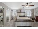 Spacious main bedroom with neutral tones, carpeted floors, ceiling fan, and closet at 3732 W Bluefield Ave, Glendale, AZ 85308