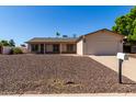 Inviting single story home featuring well-kept landscaping and a convenient two-car attached garage at 3828 W Crocus Dr, Phoenix, AZ 85053