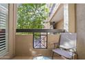 Relaxing balcony area with a chair and view of mature trees for relaxing outdoors at 420 W First St # 217, Tempe, AZ 85281