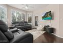 Bright living room featuring gray sofa set, sleek media console, and a stylish rug at 420 W First St # 217, Tempe, AZ 85281