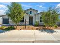 Well maintained single-story home with stone accents, desert landscaping, and a sidewalk in front at 4619 N 179Th Dr, Goodyear, AZ 85395